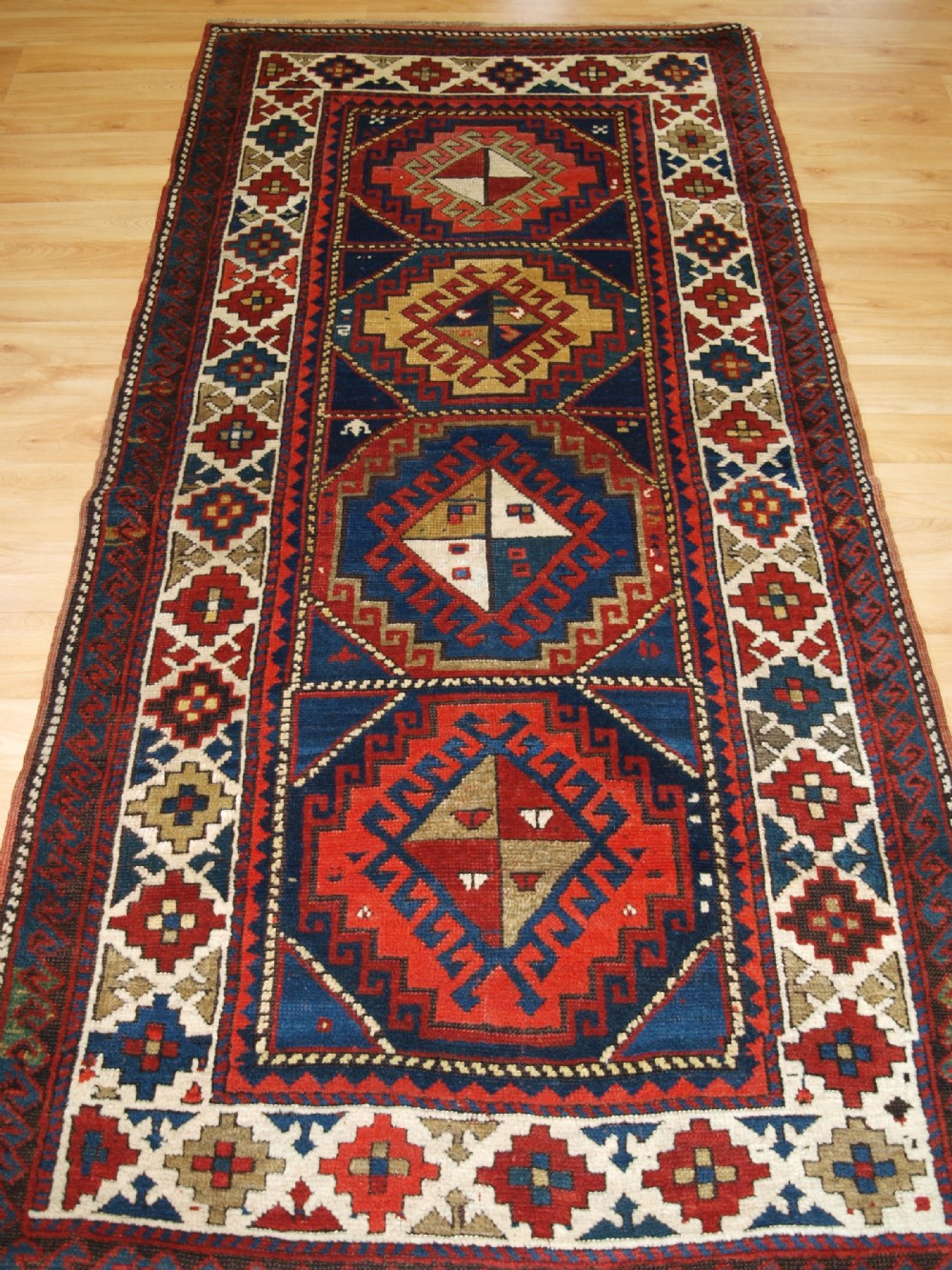 antique caucasian kazak long rug superb colour and design circa 1900