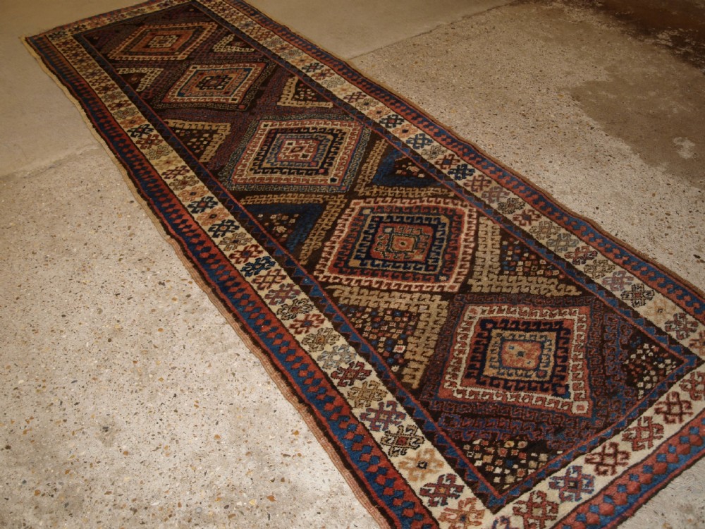 antique kurdish runner with repeat hooked medallion design circa 1900