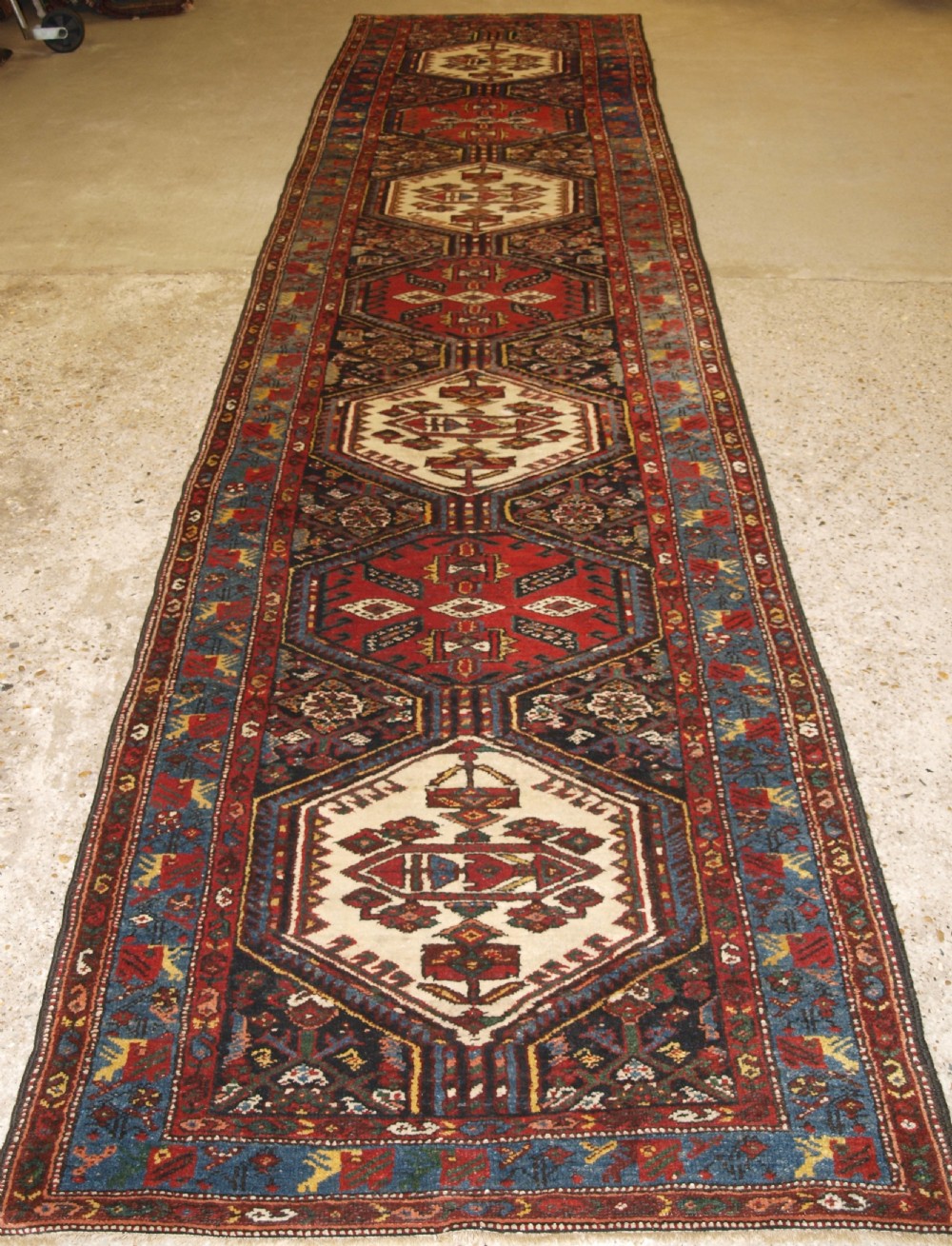 antique kurdish runner with repeat medallion design circa 1900