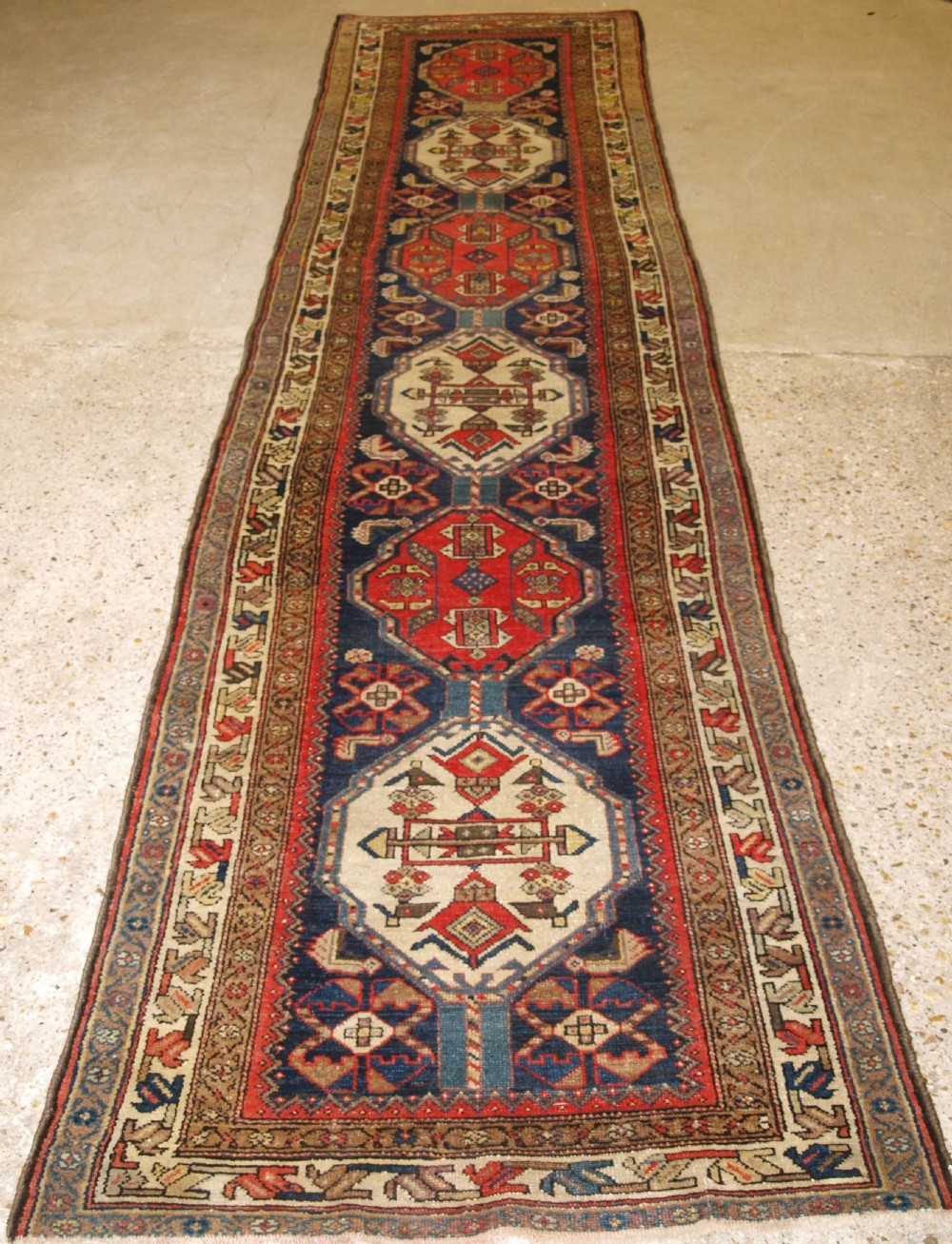 antique malayer runner with repeat medallion design circa 1900