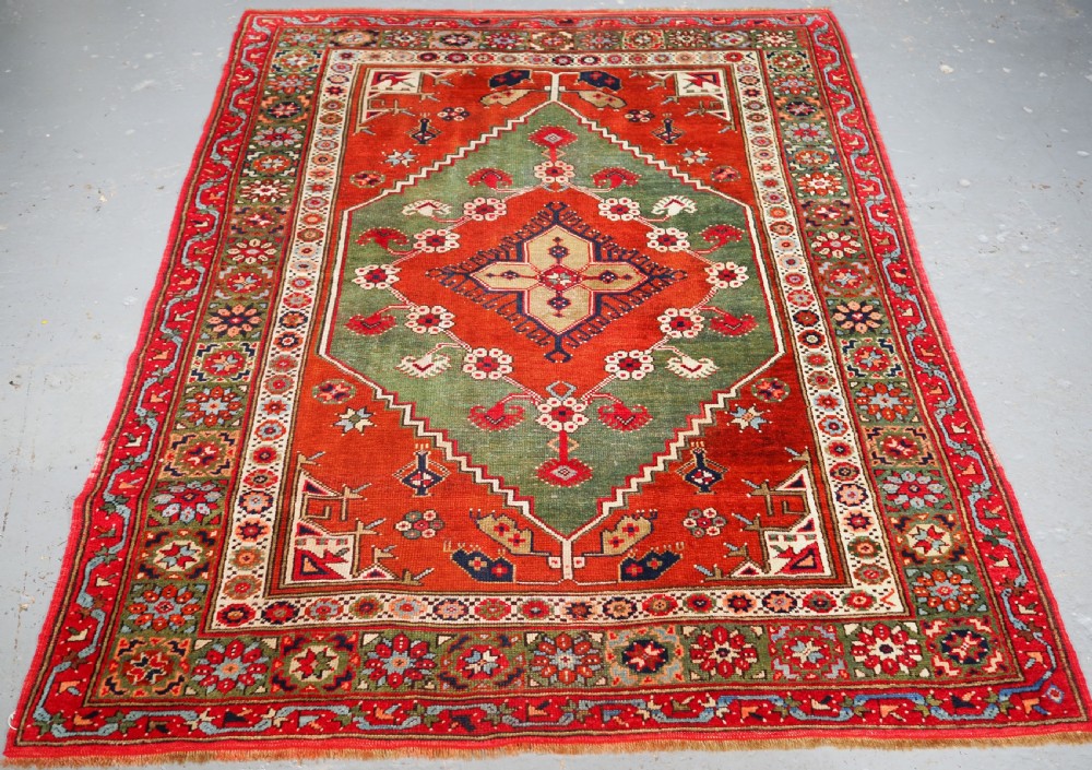 antique turkish dazkiri village rug with green ground circa 1900