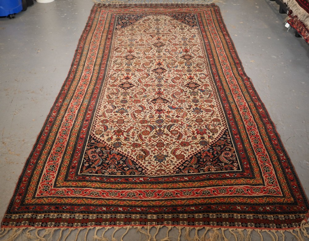 antique qashqai long rug ivory ground herati design with tibal elements circa 1870
