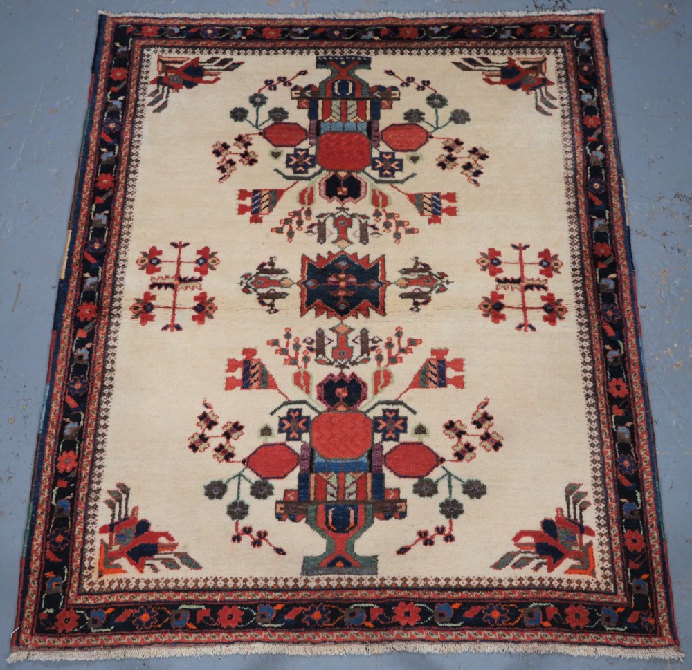 antique ivory ground afshar rug with vase design circa 1920