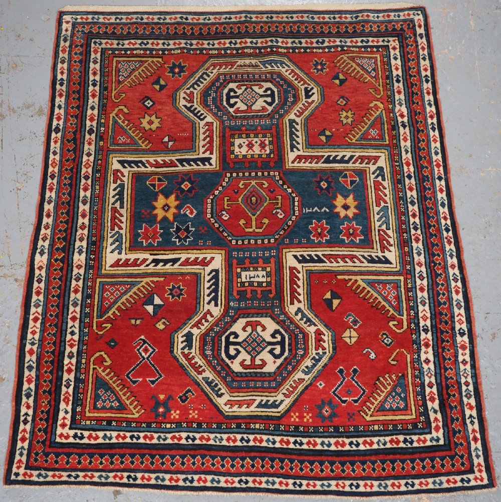 antique caucasian sewan kazak with key hole design dated 1288 1871