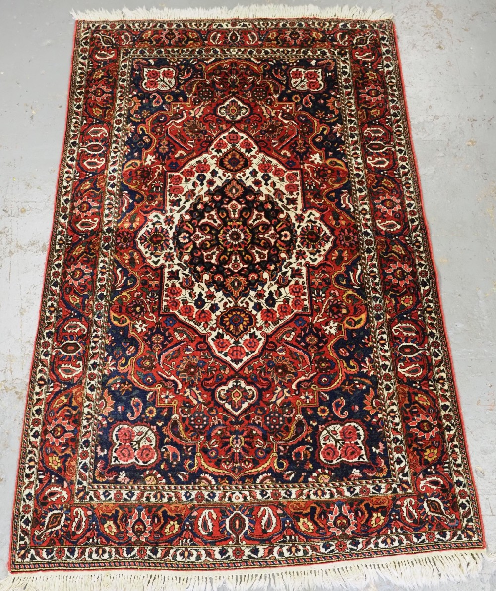 vintage bakhtiari village rug with floral medallion design circa 1930