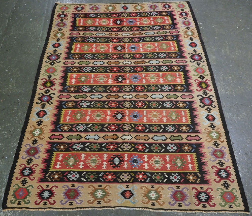 antique pirot sarkoy kilim of banded design warm soft colours circa 1920