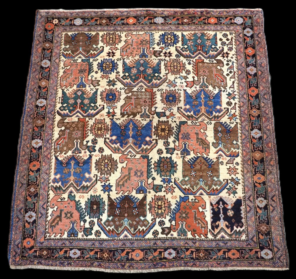 antique tribal afshar rug with dragon phoenix design on an ivory ground circa 1890