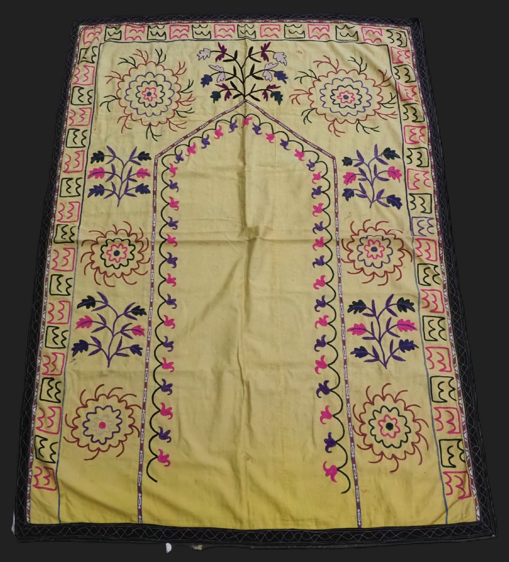 antique uzbek suzani in prayer format silk on a yellow cotton ground circa 1920